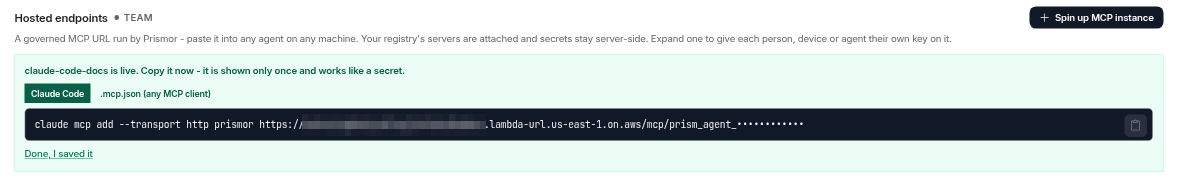 claude-code-docs is live: the Claude Code tab selected, showing claude mcp add --transport http prismor with the endpoint's lambda-url.us-east-1.on.aws URL, key masked, and a .mcp.json tab beside it