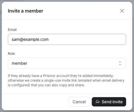 Invite a member dialog with an email field and a role picker set to member